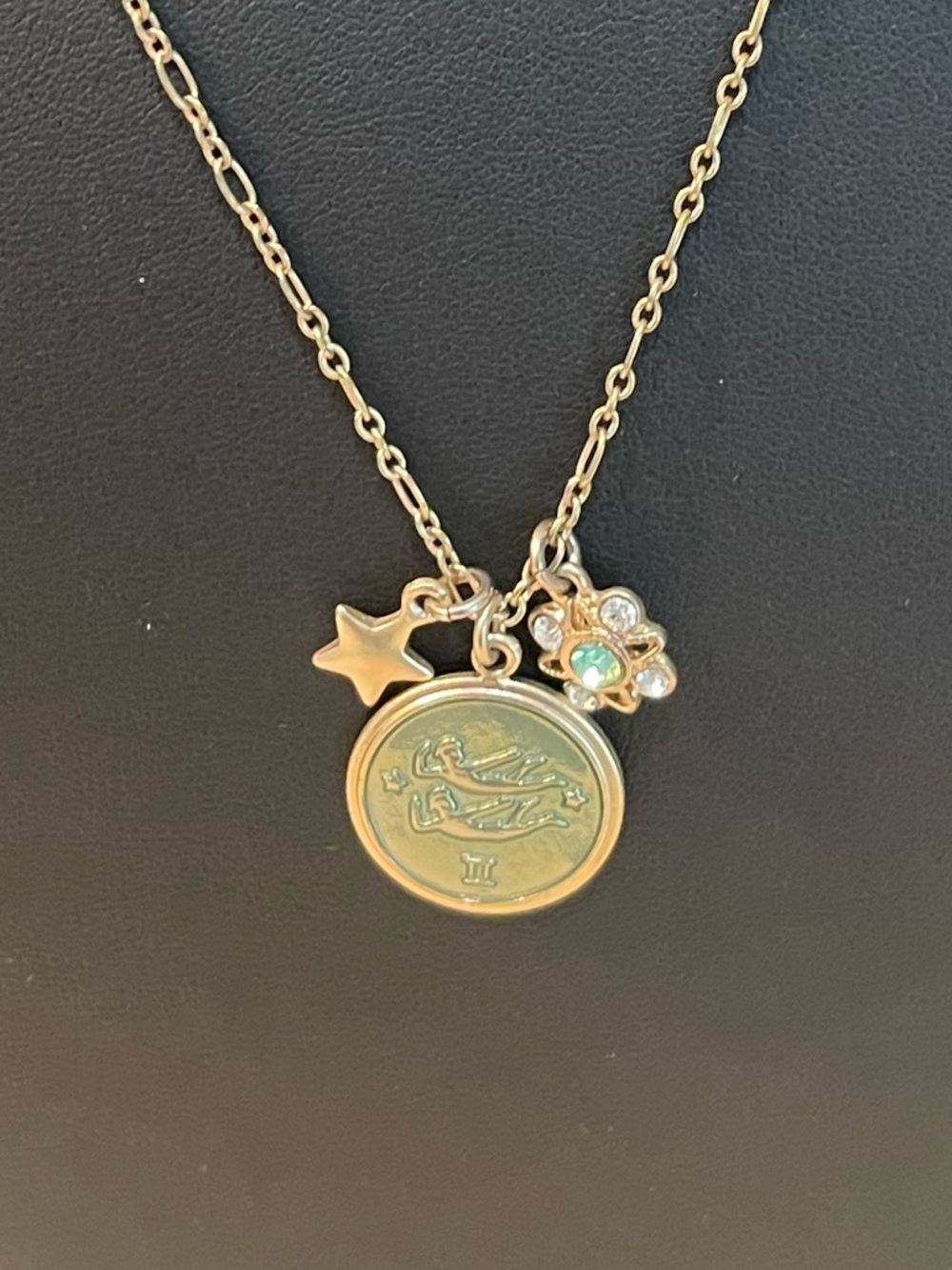 Beautiful, vintage-inspired Gemini zodiac medallion layered charm necklace.